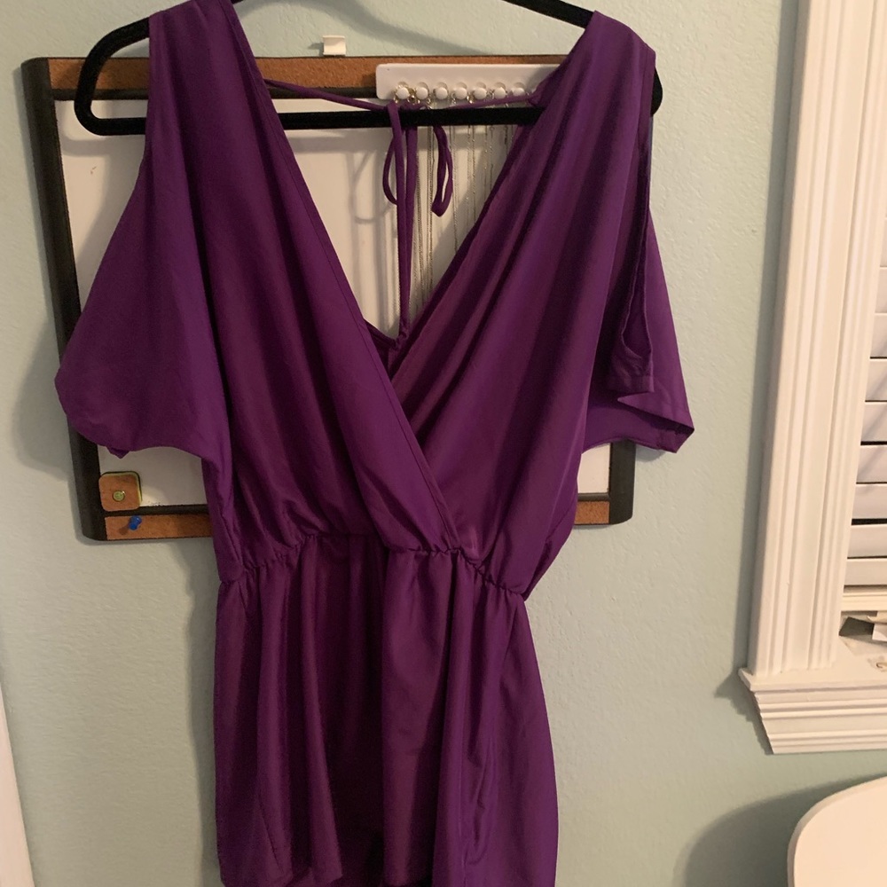 Purple cold shoulder romper.